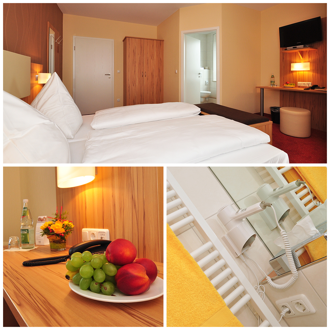 Modernes Zimmer mit Badezimmer, Dusche und frischen Handtüchern in der Pension Zeller